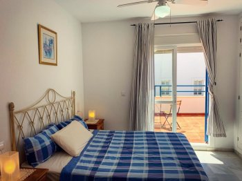 Dormitorio con terraza Casas de Vacaciones en Nuevo Portil